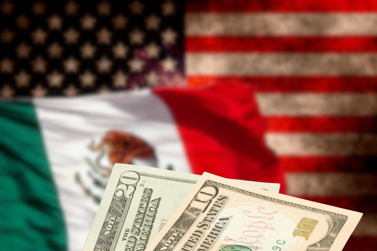 Flag of the United States of America and Mexico and dollar banknotes