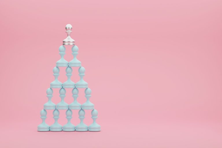 Pyramid of pastel blue pawns with a silver pawn in the top