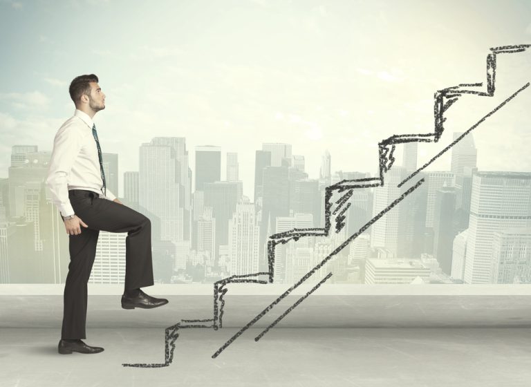 Business man climbing up on hand drawn staircase concept