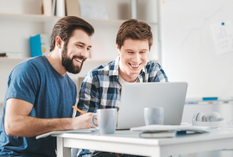 Two postgraduates watching educational video