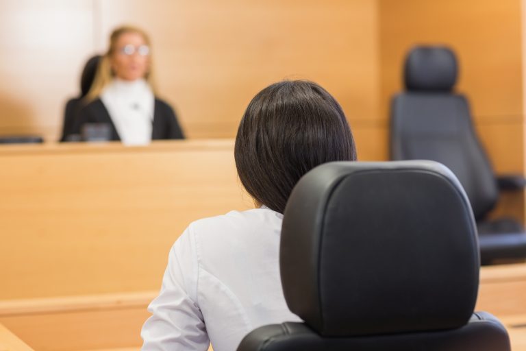 Lawyer listening to the judge in the court room